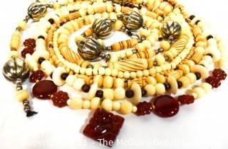 Seven (7) Strands of Carved Bone and & Garnet Beads.