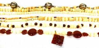 Seven (7) Strands of Carved Bone and & Garnet Beads.