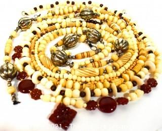 Seven (7) Strands of Carved Bone and & Garnet Beads.