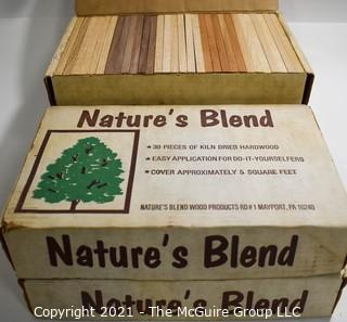 Three (3) New in Boxes Vintage Nature's Blend Mixed Kiln Dried Hard Wood Planks for Wall Covering.  Each piece measures 3/8 x 2 1/4 x 7 1/2".  Oak Cherry, Walnut and Oak