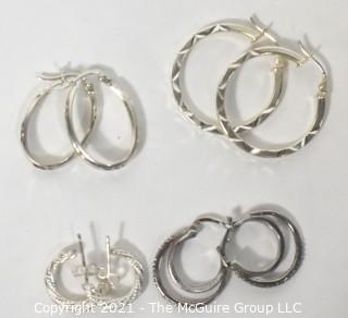 Four Pairs of Sterling Silver Pierced Hoop Earrings. 