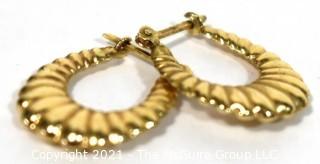 Pair of 14 kt Gold Hollow Scallop Hoop Pierced Earrings. Weighs 1.6 g