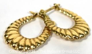 Pair of 14 kt Gold Hollow Scallop Hoop Pierced Earrings. Weighs 1.6 g