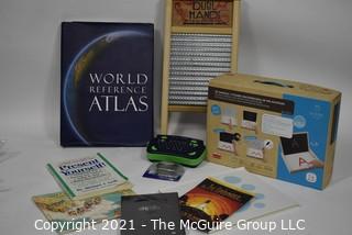 Eclectic assortment including washboard and World Atlas Book