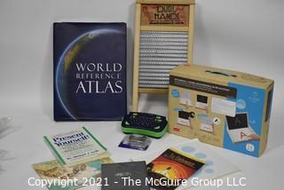 Eclectic assortment including washboard and World Atlas Book