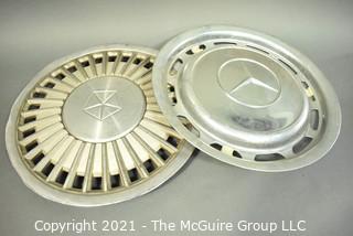 Two (2) Vintage Car Hubcaps for Chrysler and Mercedes.