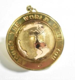 14k Yellow Gold "Around the World with You" Globe Pendant or Charm.  Weighs 10.2g 