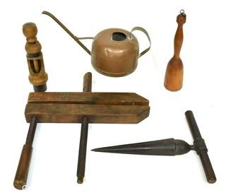 Group of Primitive Tools Including Copper Watering Can, Wood Clamp with Wooden Screws, Cast Iron Reamer, and Wooden Potato Masher. {Note: Description Altered 10.14.2021 @ 6:46pm ET}