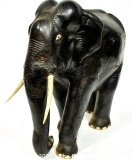 Large Asian Rosewood Carved Elephant Statue with Bone Tusks.  Measures 9" x 18" x 21". Consignor states it was an artifact in Senate Majority Leader Howard Baker's office.  