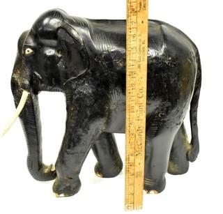 Large Asian Rosewood Carved Elephant Statue with Bone Tusks.  Measures 9" x 18" x 21". Consignor states it was an artifact in Senate Majority Leader Howard Baker's office.  