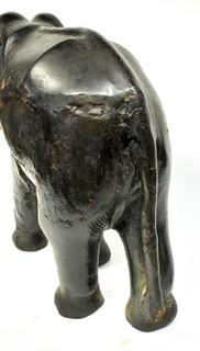 Large Asian Rosewood Carved Elephant Statue with Bone Tusks.  Measures 9" x 18" x 21". Consignor states it was an artifact in Senate Majority Leader Howard Baker's office.  