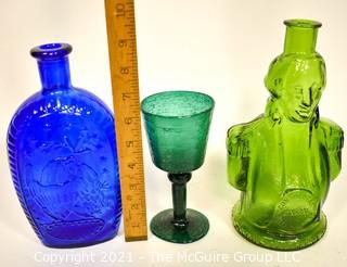 Three (3) Glass Items Including Two Glass Wheaton Bottles and One Hand Blown Wine Glass. 