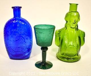 Three (3) Glass Items Including Two Glass Wheaton Bottles and One Hand Blown Wine Glass. 