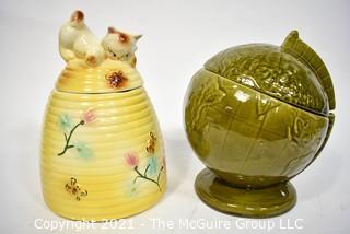 Two (2) Vintage Pottery Cookie Jars:  Green Globe and Kitten on a Beehive Made in USA.  They measure 11" tall.