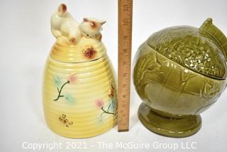 Two (2) Vintage Pottery Cookie Jars:  Green Globe and Kitten on a Beehive Made in USA.  They measure 11" tall.