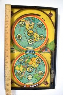 Antique Lindstrom Atlas Bagatelle or Pinball Game Made by Lindstrom Toy & Tool Company of Bridgeport, Connecticut. Double circle play with maps of the world top and bottom It measures 14” x 24” . 