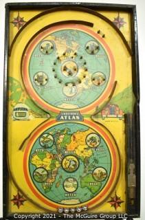 Antique Lindstrom Atlas Bagatelle or Pinball Game Made by Lindstrom Toy & Tool Company of Bridgeport, Connecticut. Double circle play with maps of the world top and bottom It measures 14” x 24” . 