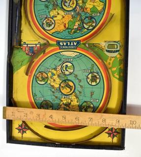 Antique Lindstrom Atlas Bagatelle or Pinball Game Made by Lindstrom Toy & Tool Company of Bridgeport, Connecticut. Double circle play with maps of the world top and bottom It measures 14” x 24” . 