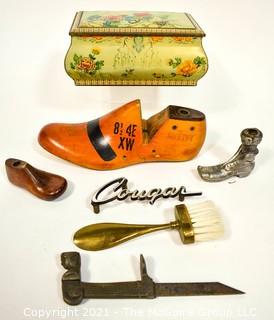 Collection of Vintage Items Including Lady Figure Shutter Dog, English Bisquit Tin, Victorian Promotional Item from Shoemaker, Shoe Forms and "Cougar" car plate