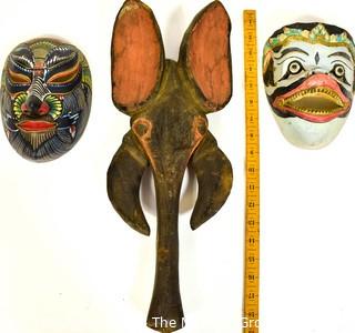 Three (3) Painted and Hand Carved Wooden Masks.  