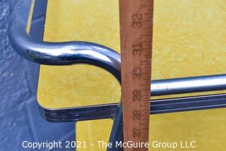 Mid Century Yellow Formica and Chrome Serving or Bar Cart on Wheels. Measures 19" x 28" x 32". 