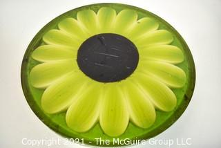 Mid Century Modern Lucite or Acrylic Large Green Sunflower Made by New Designs Inc, 1969.  It measures 16"D x 1" thick. 