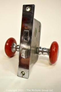 Art Deco Locking Mechanism with Red Handle Door Knob.