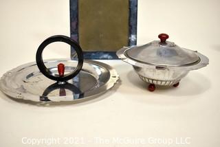 Blue Glass Mirror Frame and Two Chrome and Bakelite Serving Items.