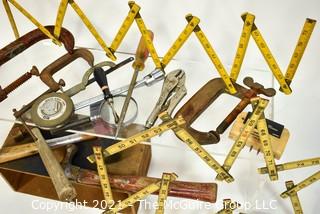 Assortment of Hand Tools, including folding rules, "C" Clamps, Vise Grips, hammers and mallets.