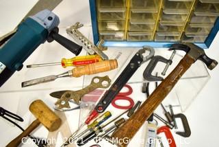 Assortment of tools including wooden mallet, hammer, metal shearing scissors, electric angle grinder and metal screw organizer bin