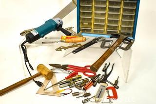 Assortment of tools including wooden mallet, hammer, metal shearing scissors, electric angle grinder and metal screw organizer bin