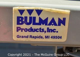 Four Paper Roll Vertical Dispenser Rack by Bulman. 