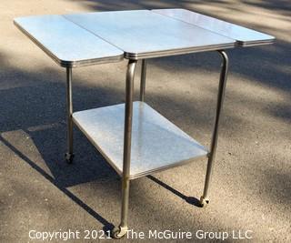 Vintage Mid Century Grey Marbled Formica Top Drop Leaf Table with Chrome Trim. 33" wide when leaves up, 30" tall.