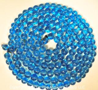 Two (2) Round Blue Glass Crystal Bead Strands.  They Measures 41" and 16".