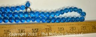 Two (2) Round Blue Glass Crystal Bead Strands.  They Measures 41" and 16".