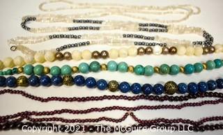 Six (6) Strands of Mixed Stone Beads Including Garnet, Mother of Pearl, Bone.