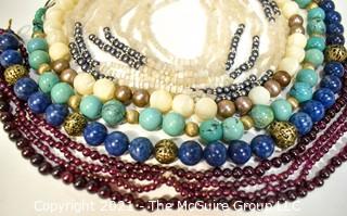 Six (6) Strands of Mixed Stone Beads Including Garnet, Mother of Pearl, Bone.