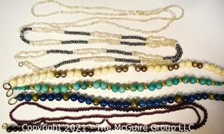 Six (6) Strands of Mixed Stone Beads Including Garnet, Mother of Pearl, Bone.