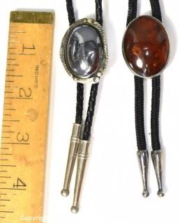 Two (2) Vintage Unmarked Sterling Silver Bolo Ties with Amber and Hematite Stones.