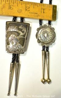 Two (2) Sterling Native American Artisan Made Bolo Ties.  One unmarked Sterling, One marked sterling and signed by Navajo artist Jereme Delgarito.