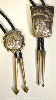 Two (2) Sterling Native American Artisan Made Bolo Ties.  One unmarked Sterling, One marked sterling and signed by Navajo artist Jereme Delgarito.