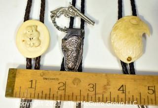 Three (3) Bolo Ties - Two Carved of Bone, One is Articulated Pistol with Holster. 