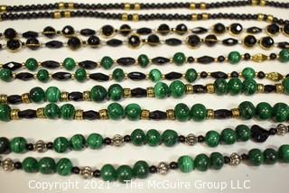 Five (5) Strands of Green Malachite with Black Faceted Glass Beads.