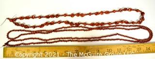 Two (2) Strands of Red Jasper Beads.  One measures 60" long. 