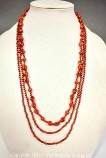 Two (2) Strands of Red Jasper Beads.  One measures 60" long. 