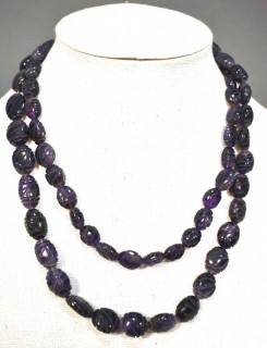 One (1) Carved Oval Amethyst Strand of Beads.  Measures 40".