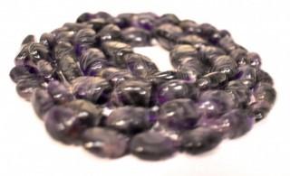 One (1) Carved Oval Amethyst Strand of Beads.  Measures 40".