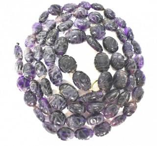 One (1) Carved Oval Amethyst Strand of Beads.  Measures 40".