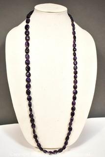 One (1) Carved Oval Amethyst Strand of Beads.  Measures 40".