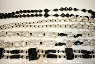 Four (4) Clear and Black Faceted Black Bead Strands. 